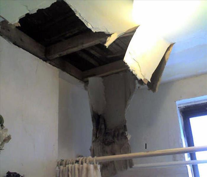 Leaking Roof Causes Ceiling Collapse