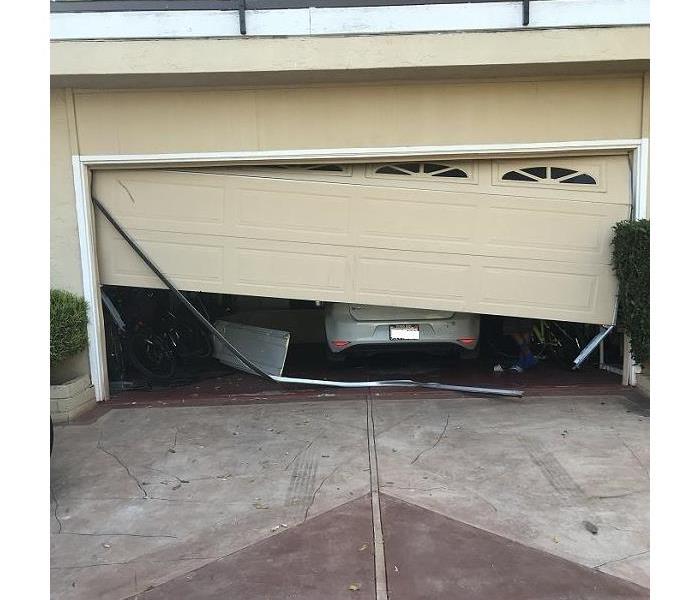 Car Goes Into Garage Incident 